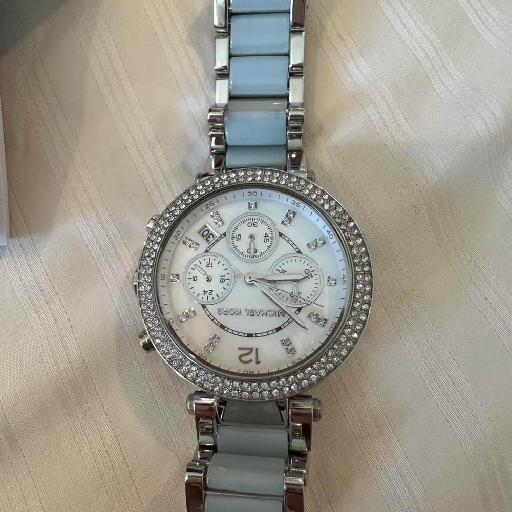 Blue and silver Michael Kors watch.